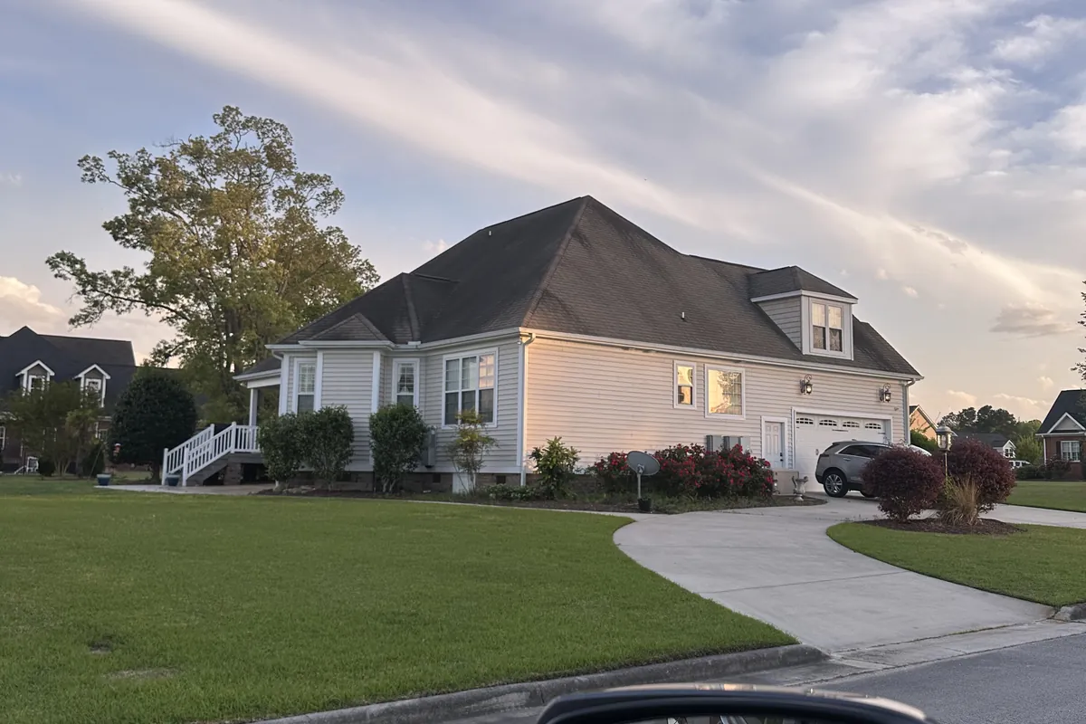 Finished roof on a home at dusk in Eastern North Carolina